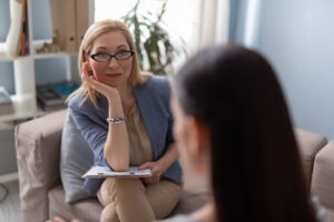 A social worker talks with a client.