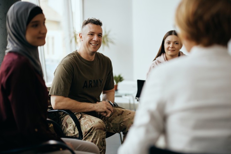 A veteran participates in a group therapy session.